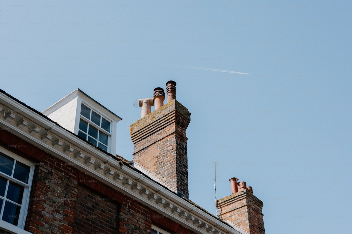 Chimney rebuild with new stonework and pots